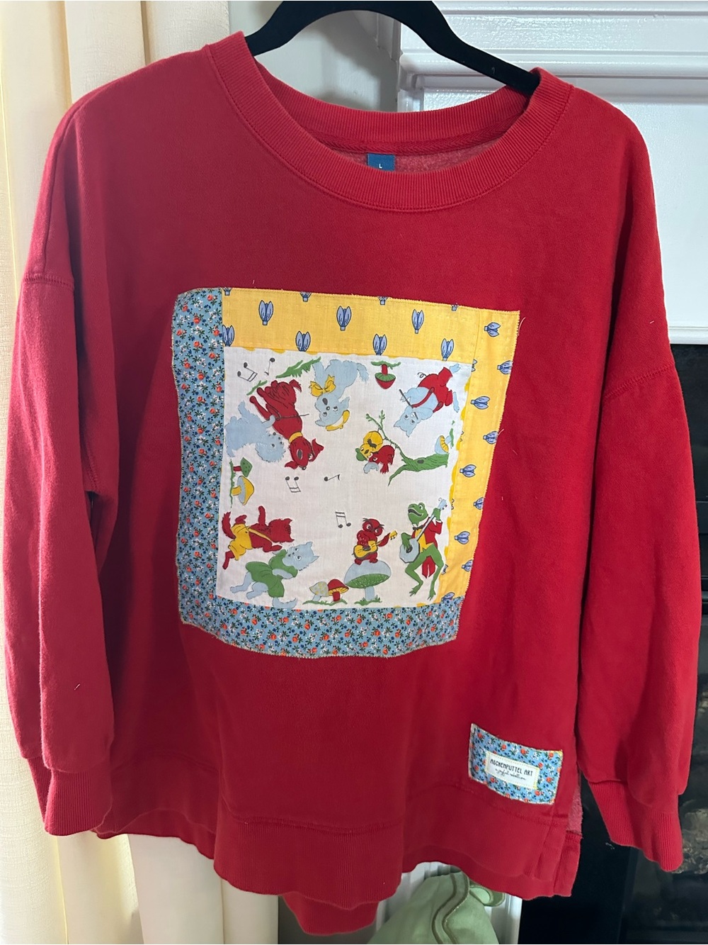 Red sweatshirt with vintage hanky appliqué